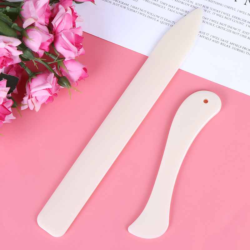 【F】قطعتان من أدوات فتح المغلفا - مراجعة Bone Folder Tool وسعره